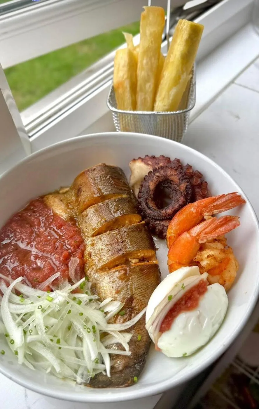 LIMS seafood platter — grilled fish, octopus and prawns with onions, pepper sauce and yam chips